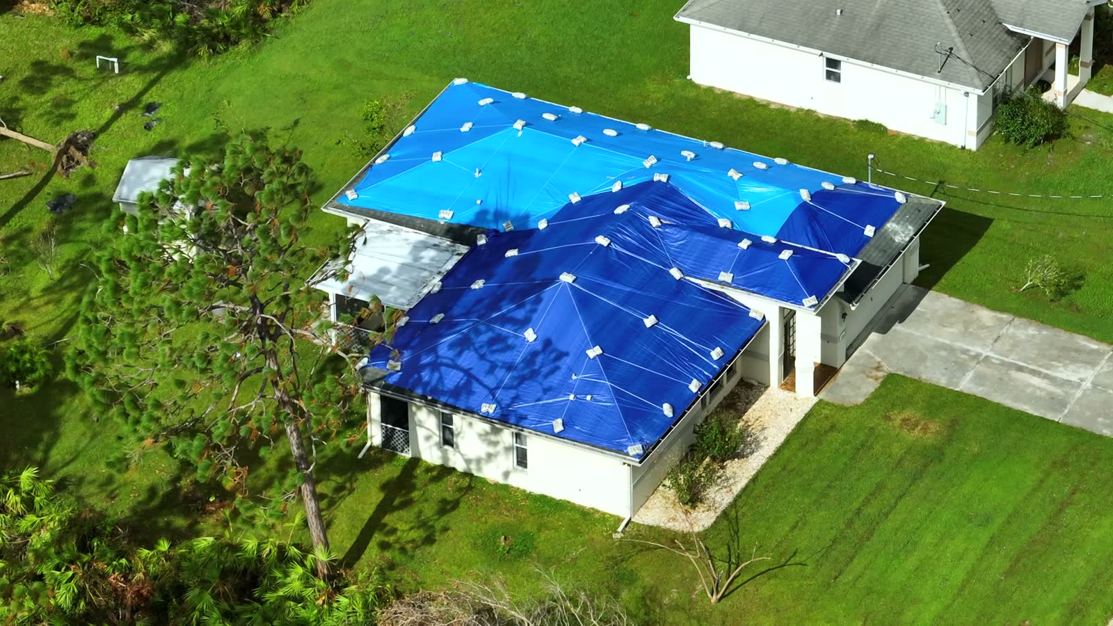 aerial-view-of-damaged-in-hurricane-ian-house-roof.mp4