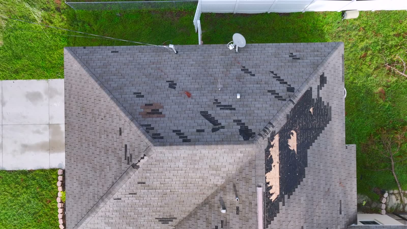 aerial-view-of-damaged-roof-covered-by-tarp.mp4
