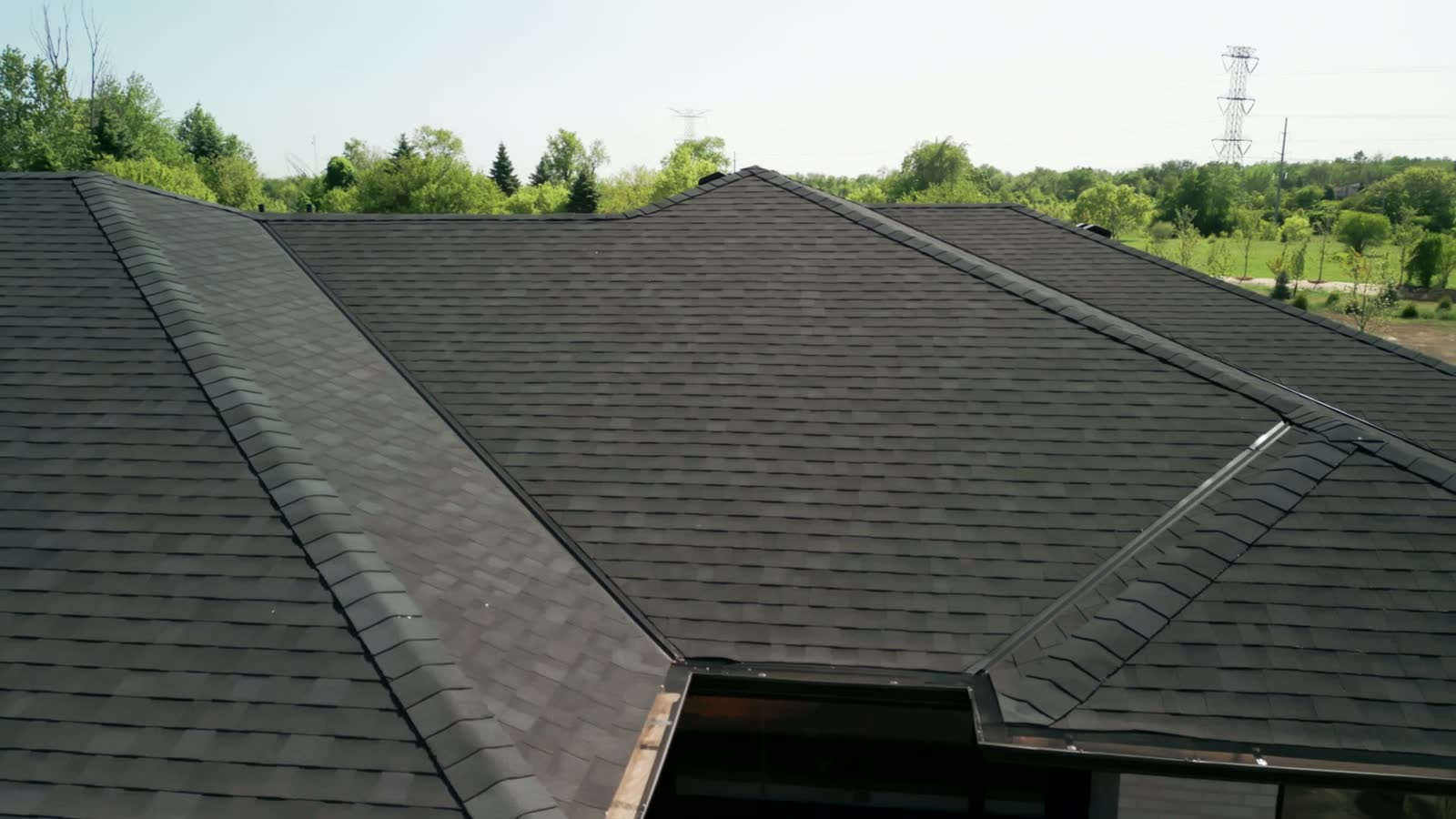 aerial-view-of-dark-grey-suburban-home-roof.mp4