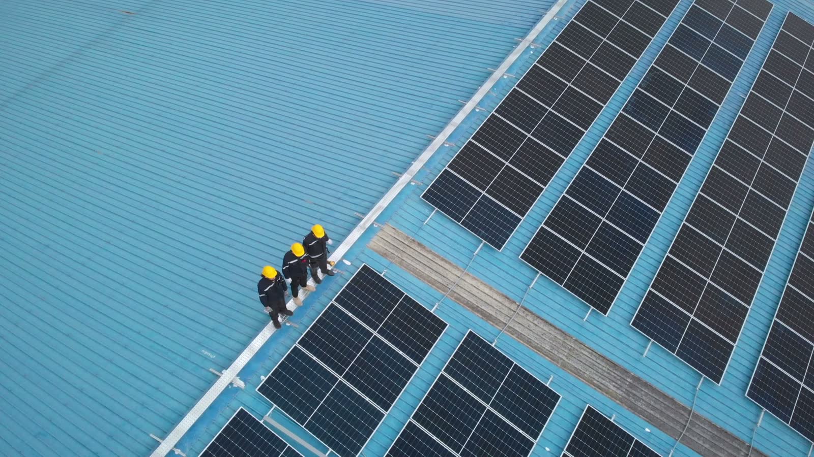 aerial-view-of-engineer-worker-walking-on-rooftop.mp4