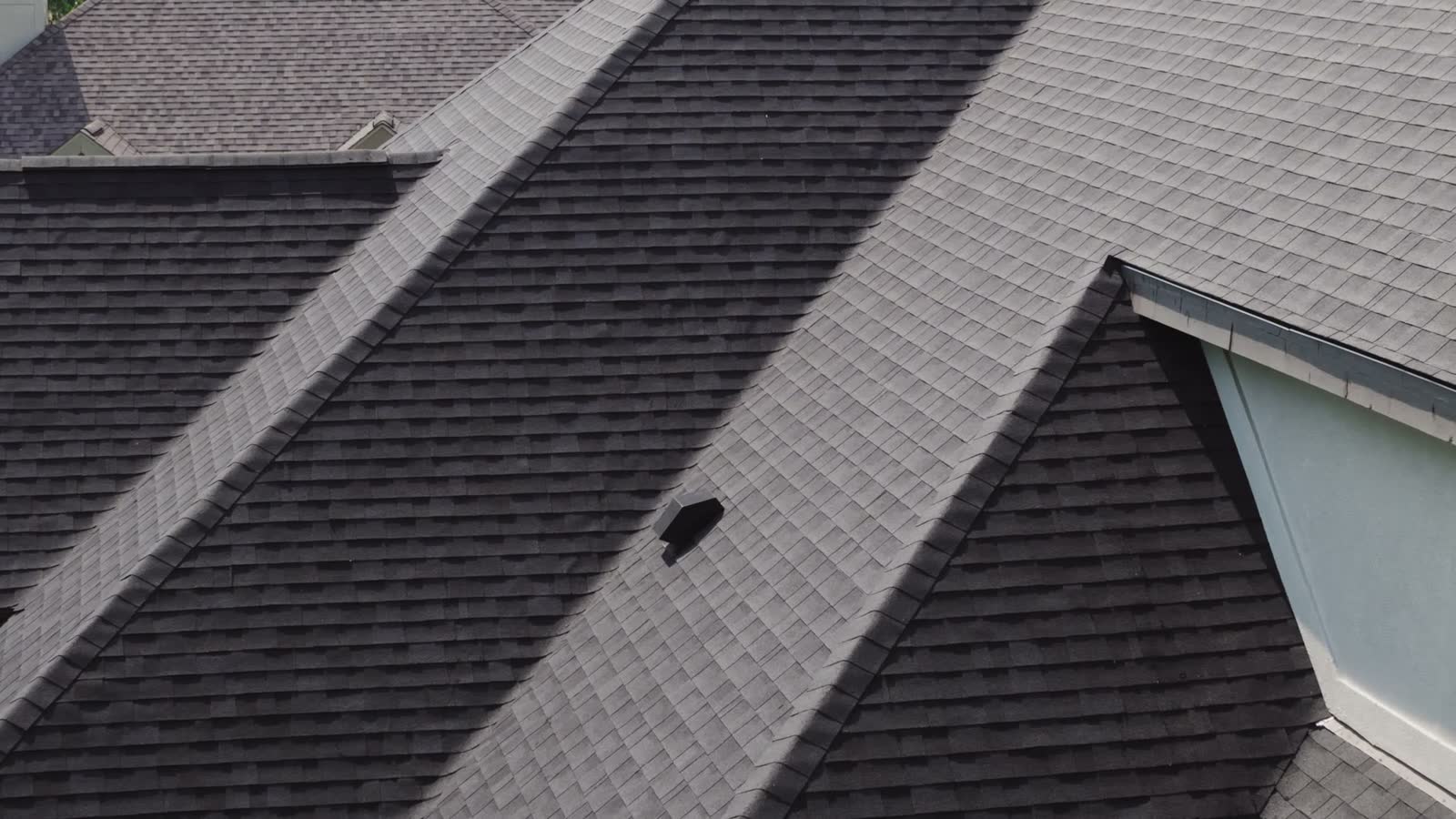 aerial-view-of-residential-house-roofs-in-suburbs.mp4