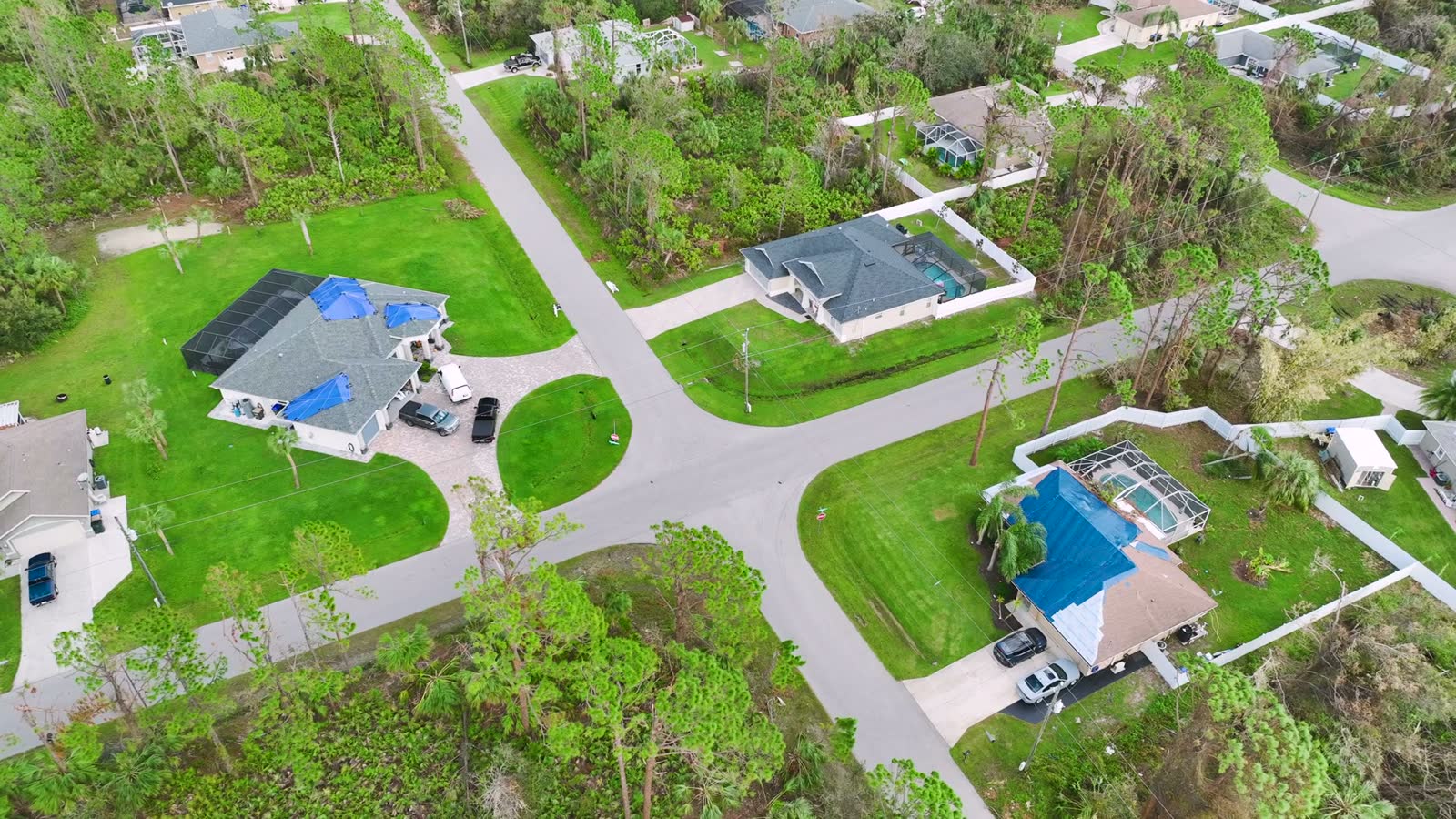 aerial-view-of-suburban-houses-with-damaged-roofs.mp4