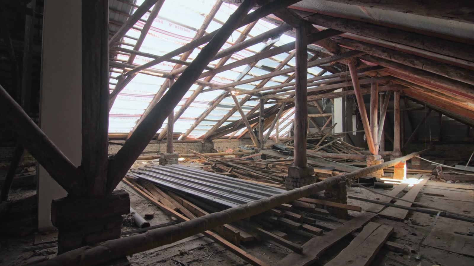 attic-of-old-building-with-partly-disassembled-roo.mp4