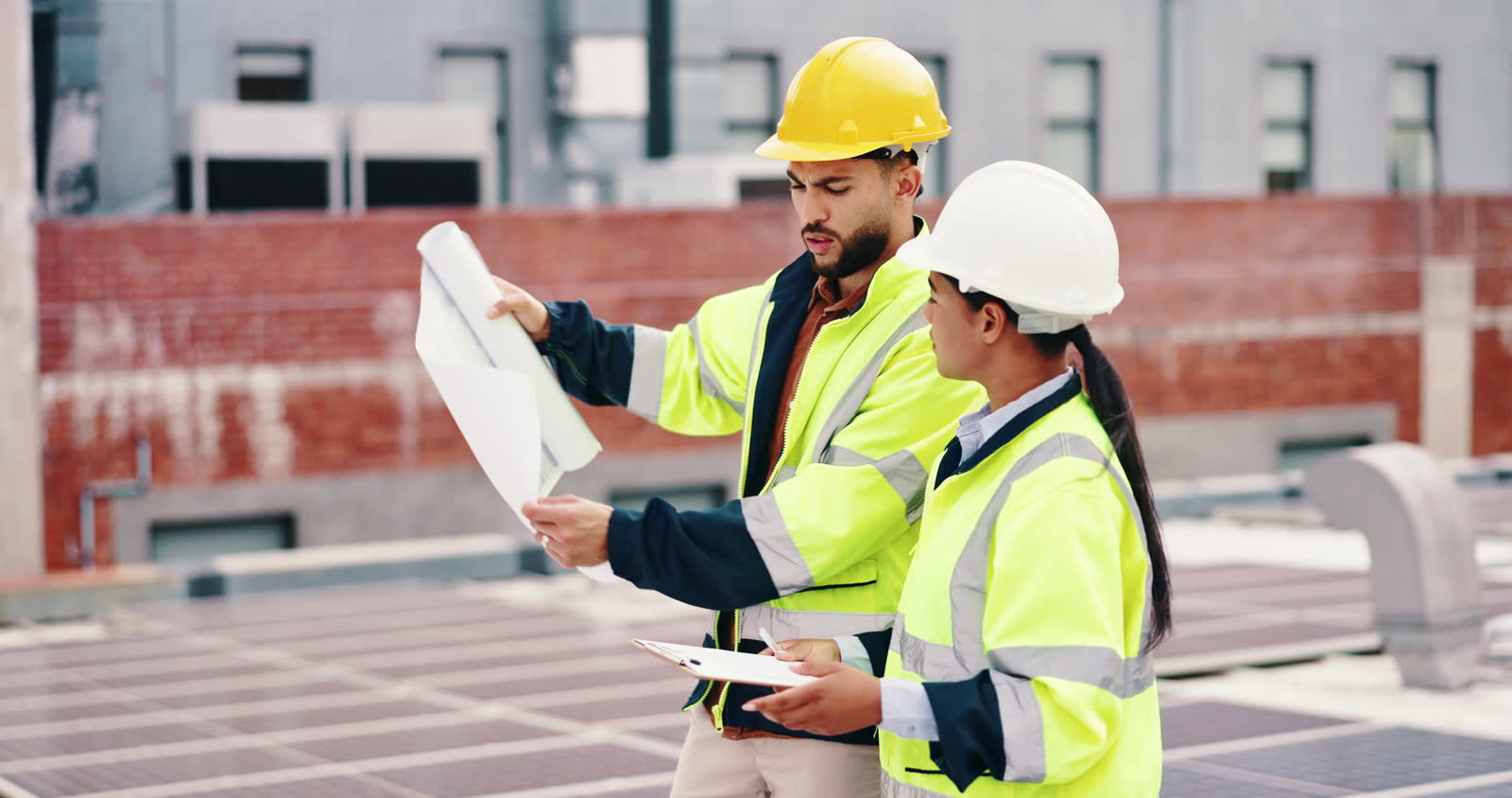 blueprint-clipboard-and-rooftop-with-construction.mp4