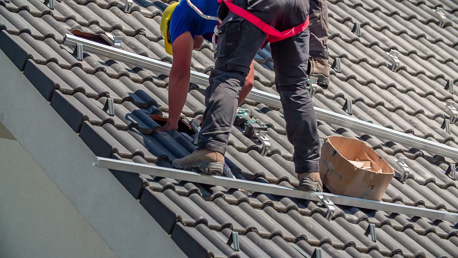 close-up-of-repairmen-renovating-the-rooftop-of-h.mp4