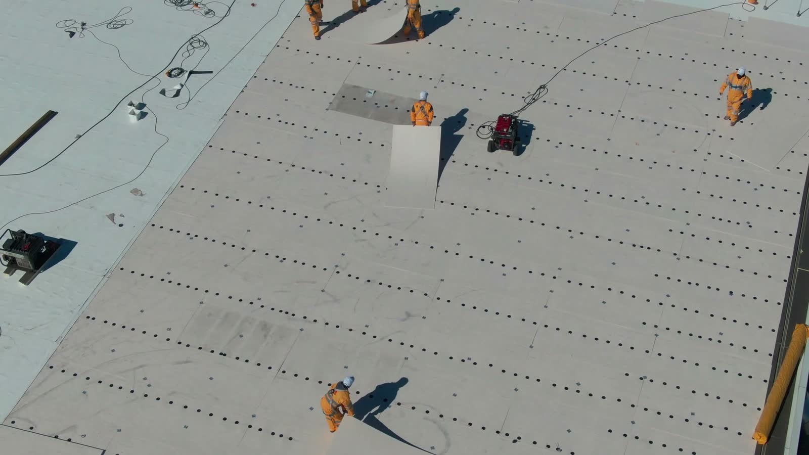 construction-workers-installing-roof-from-above.mp4