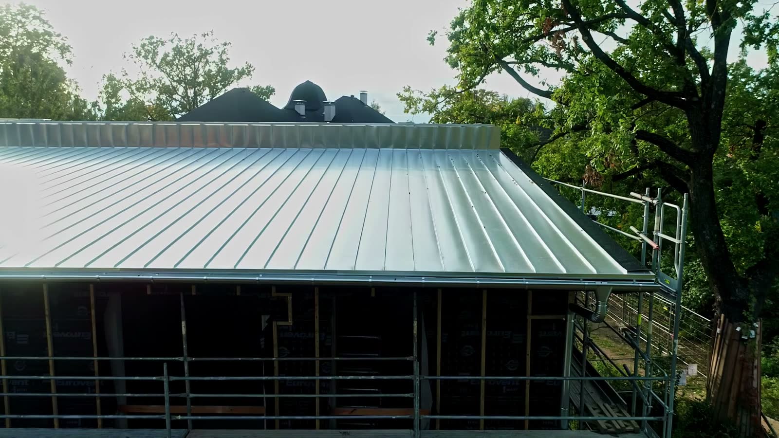 drone-footage-of-new-house-construction-site-roof.mp4