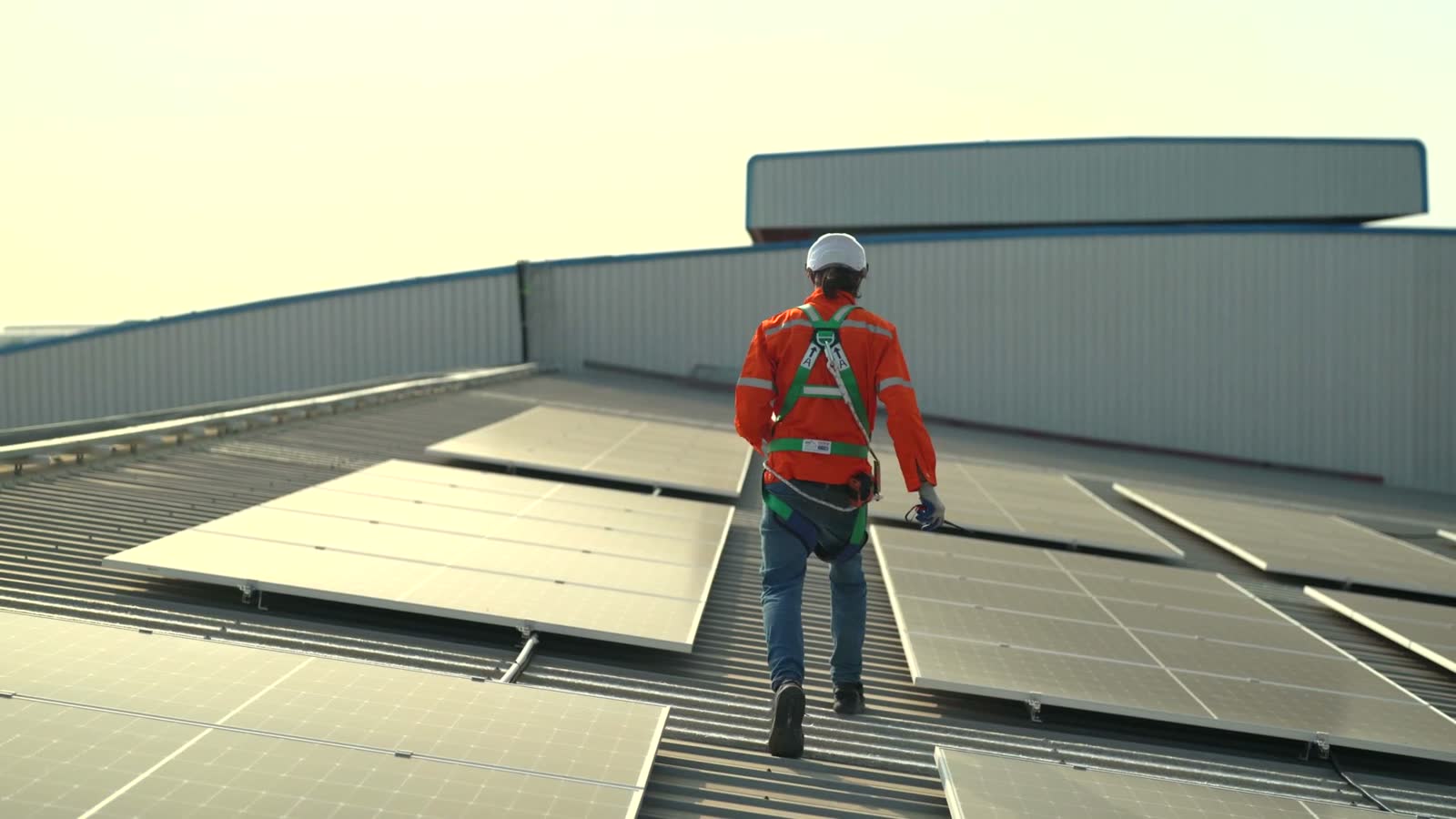 engineer-inspecting-solar-panels-on-rooftop.mp4
