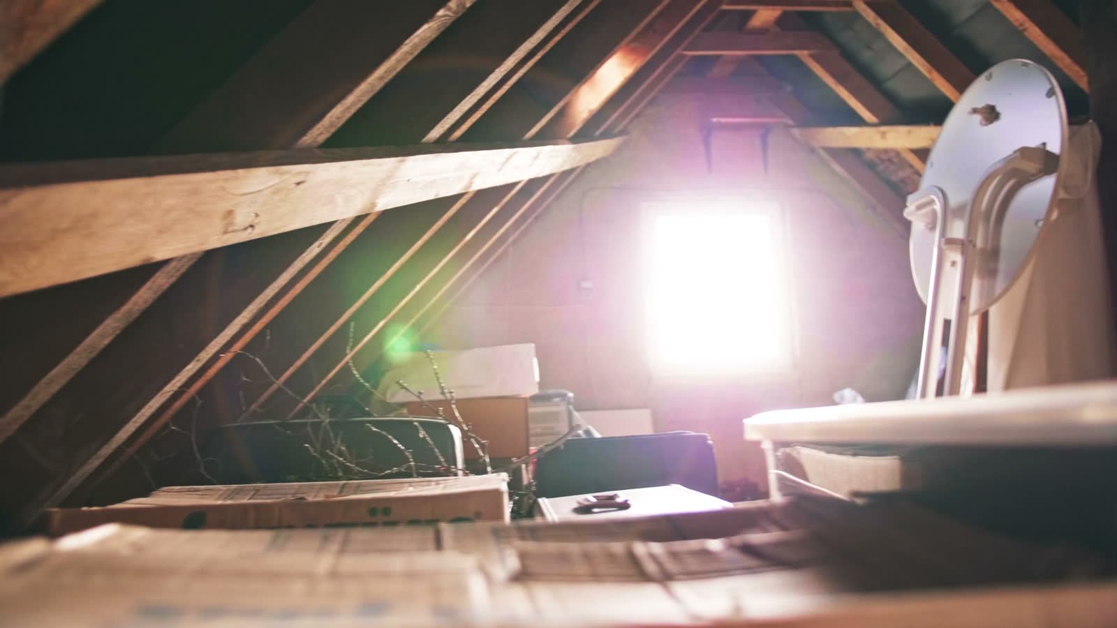 pan-on-bright-lens-flare-in-interior-pitched-roof.mp4