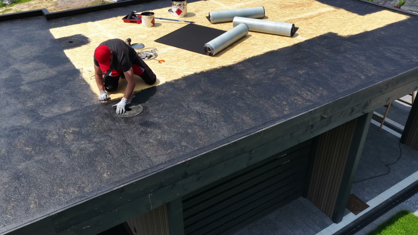 roof-installation-process-with-rolled-materials-at.mp4