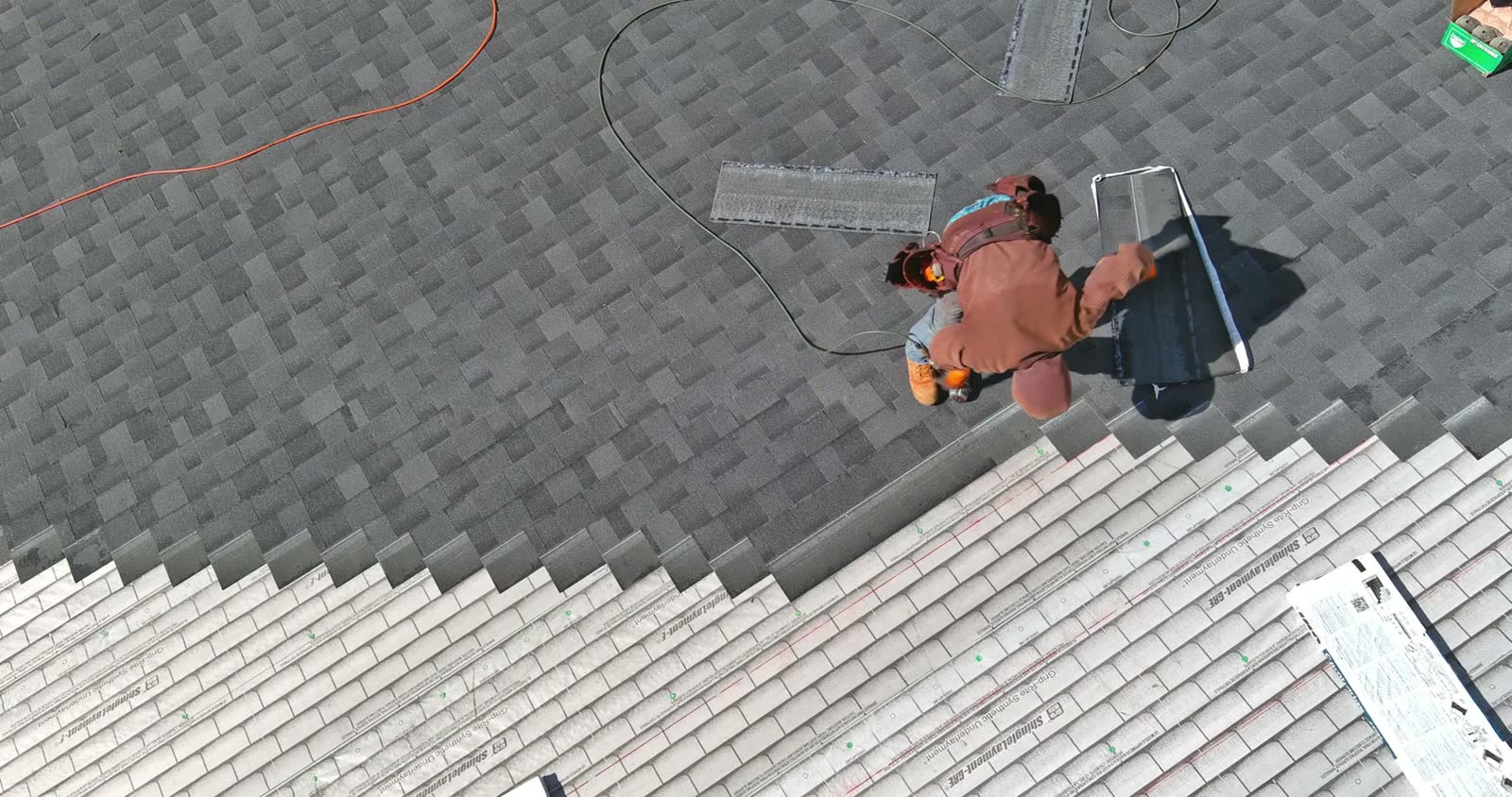 roofer-installing-shingles-on-house-roof-aerial-vi.mp4