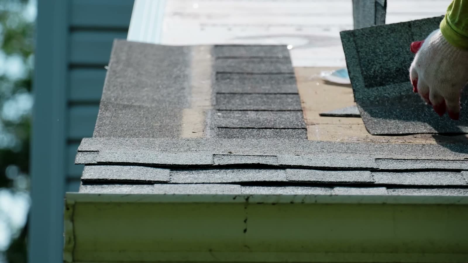 roofer-installs-asphalt-shingles-on-a-home-roof.mp4