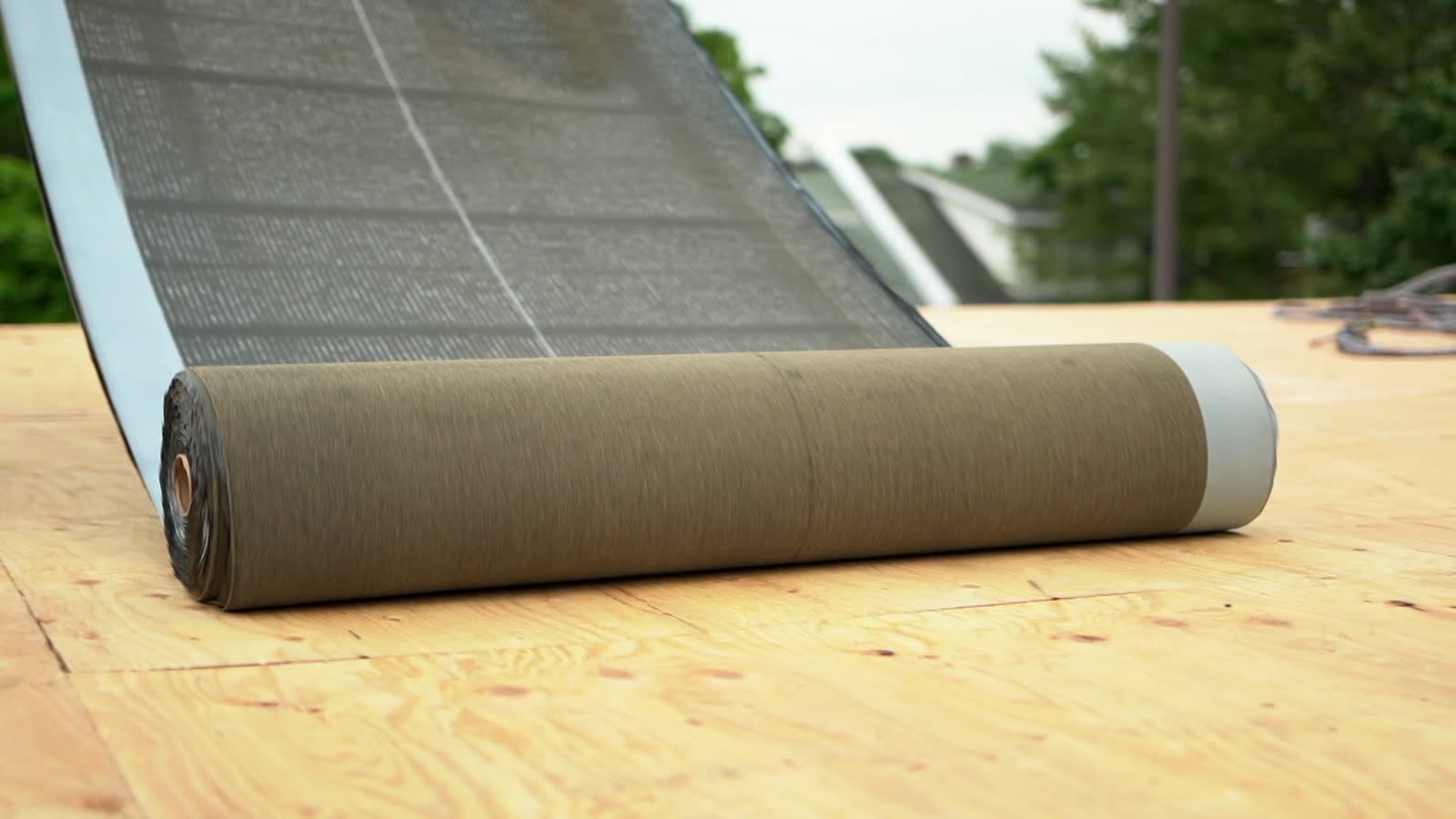 roofing-material-roll-on-new-roof.mp4
