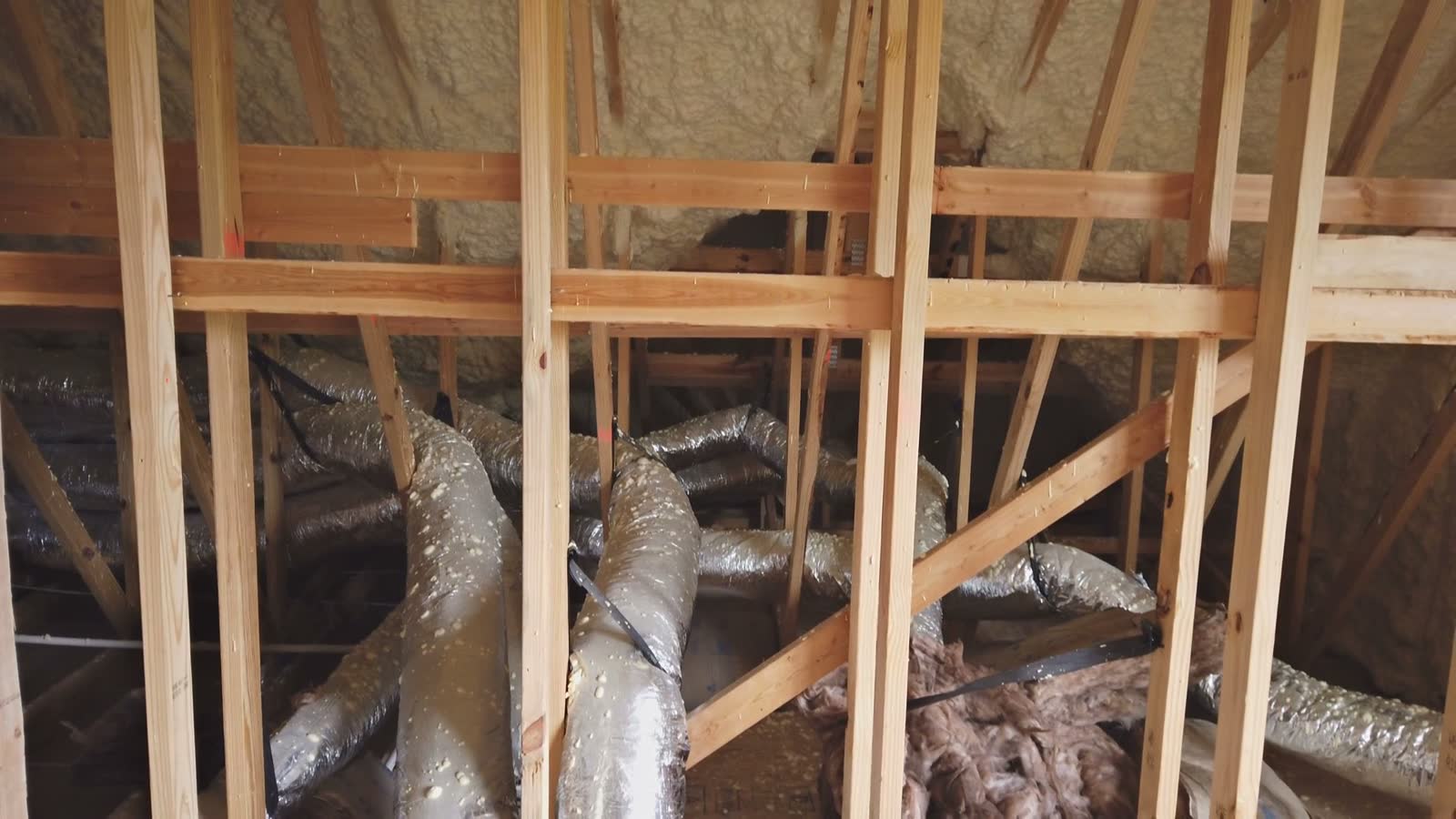 unfinished-attic-with-insulation-and-ductwork.mp4