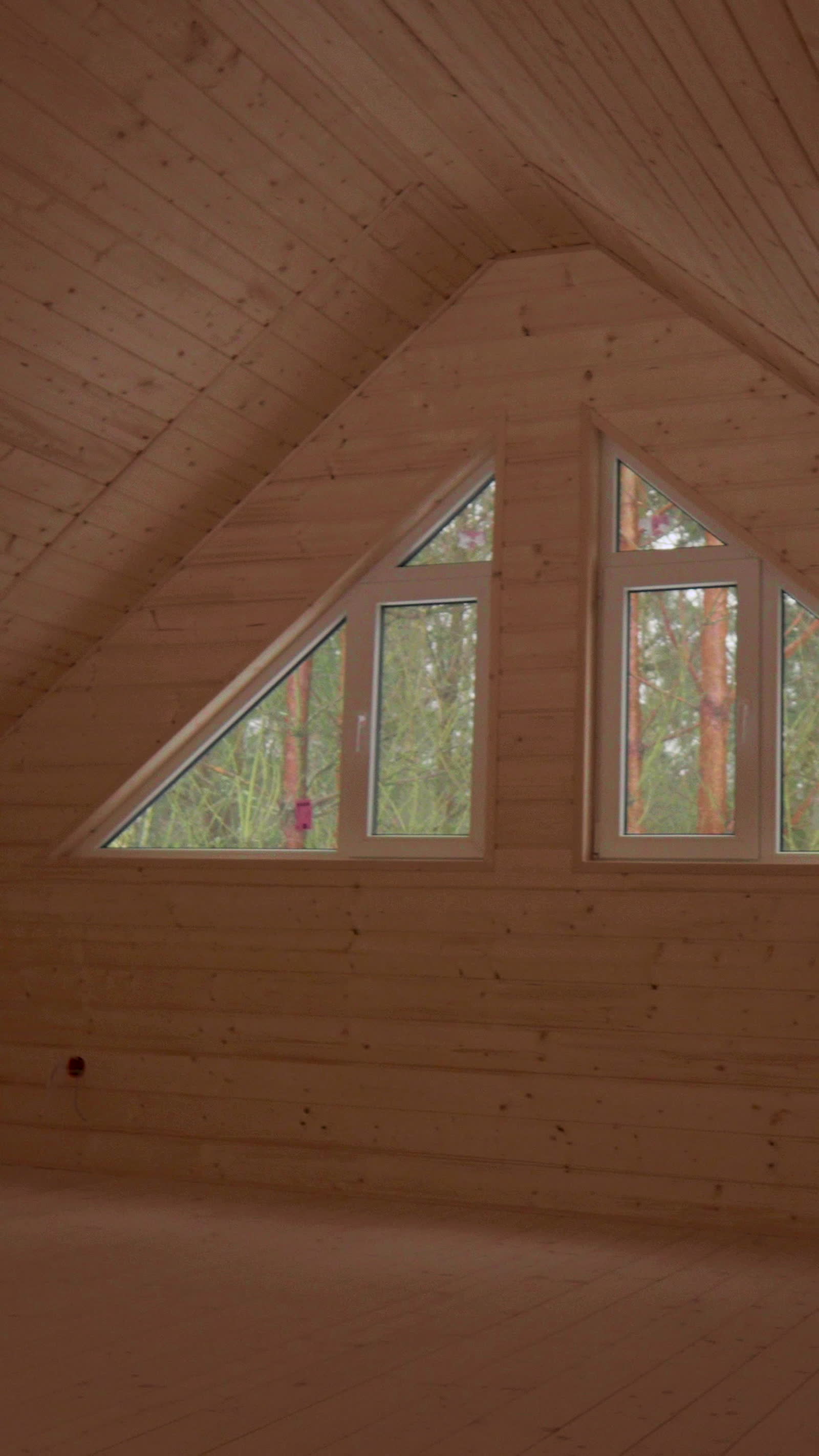 wooden-attic-interior-with-windows-and-sunlight.mp4