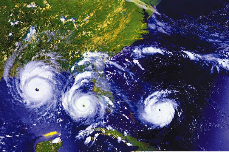 Three-frame composite of Andrew: over the Bahamas, at Florida landfall, and in the Gulf, August 23-25, 1992