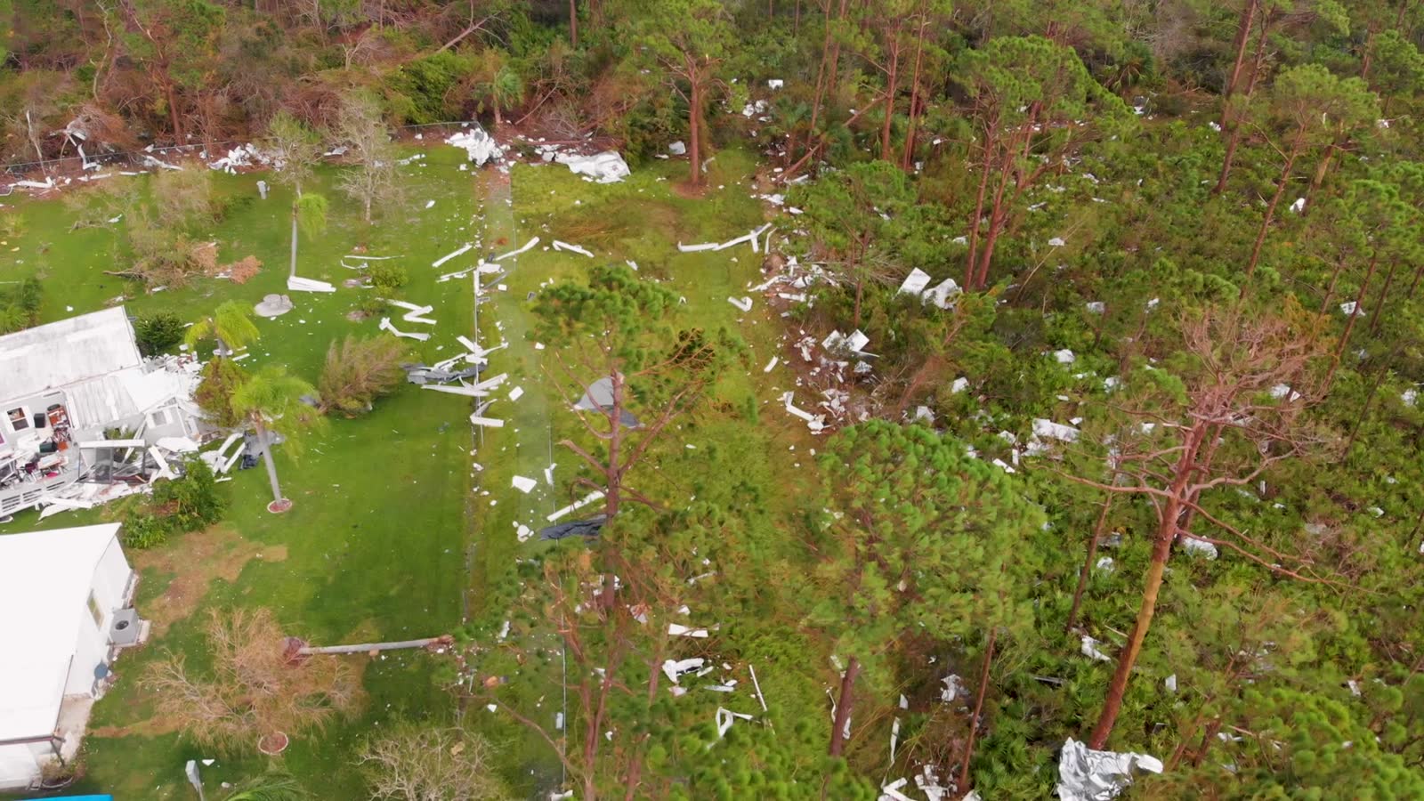 4k-drone-video-of-debris-in-trees-from-homes-destr.mp4